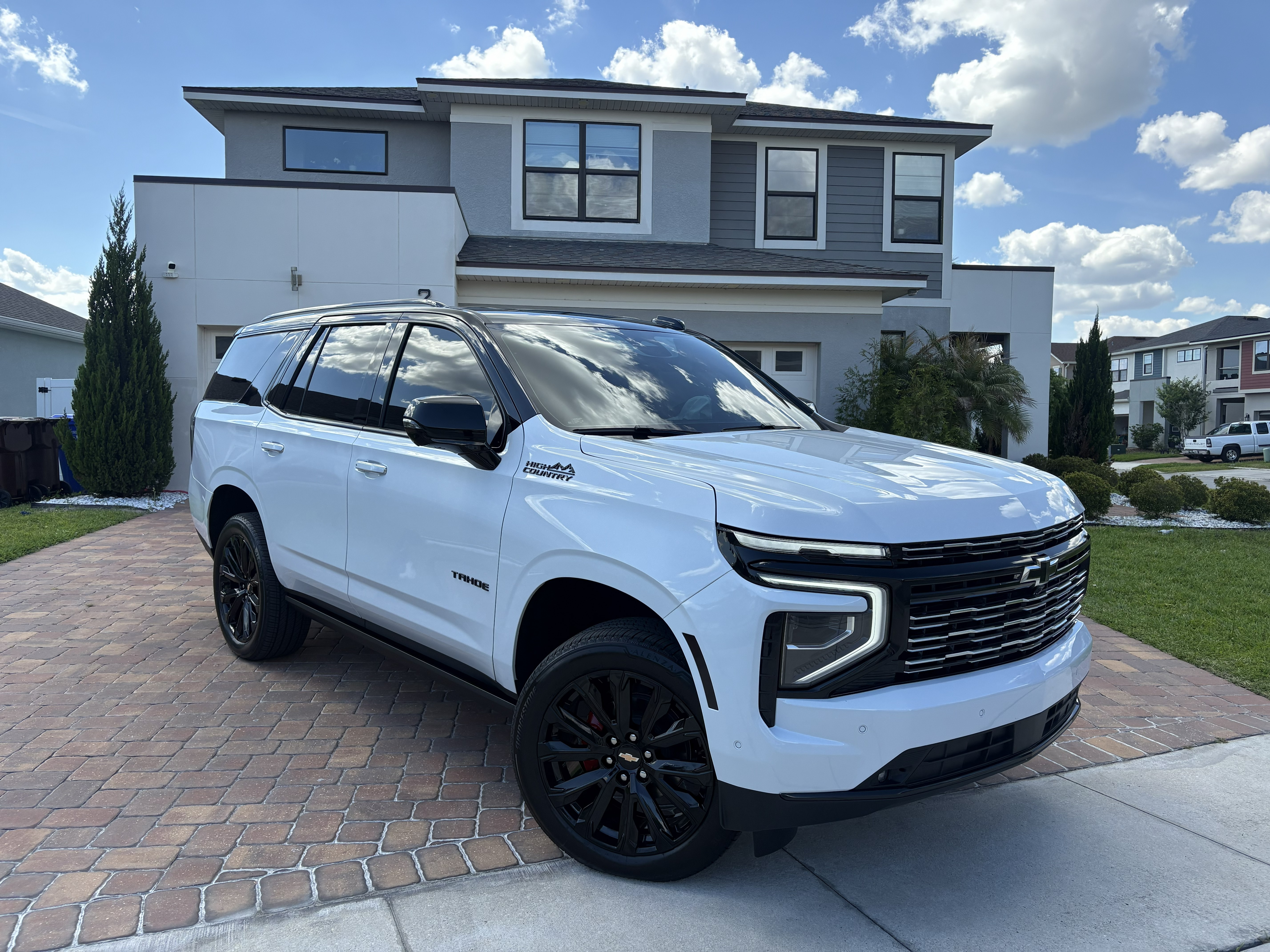 Chevy Tahoe High Country tuxedo gloss black wrap with PPF ceramic coating and nano ceramic tint South Florida